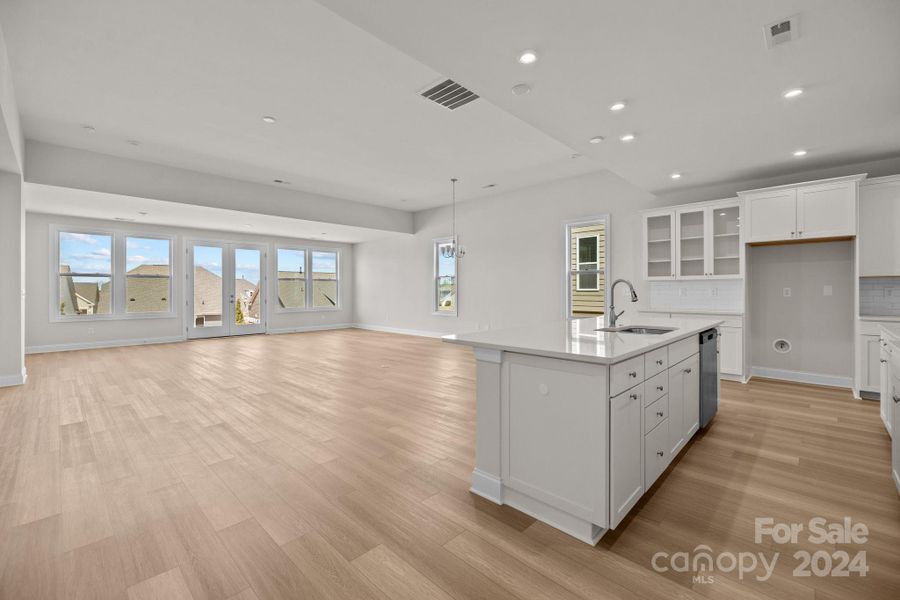 The furniture placement possibilities are endless in this gorgeous Great Room with Sunroom extension.