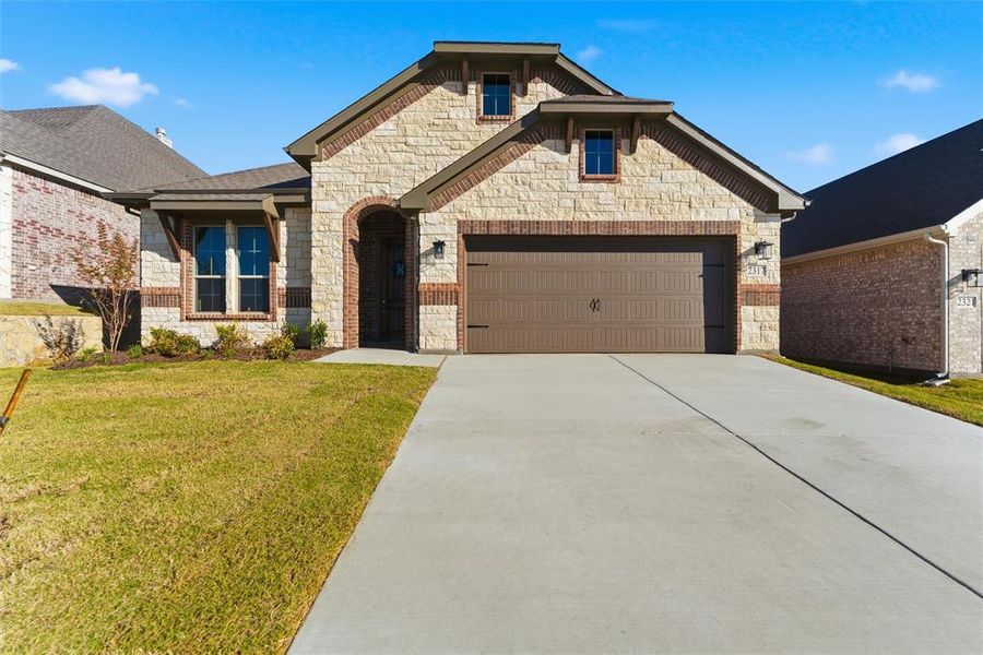 Front exterior of a new home in Waterford Park, Weatherford, TX, highlighting curb appeal (Image 23). Front exterior of a new home in Waterford Park, Weatherford, TX, highlighting curb appeal (Image 23).