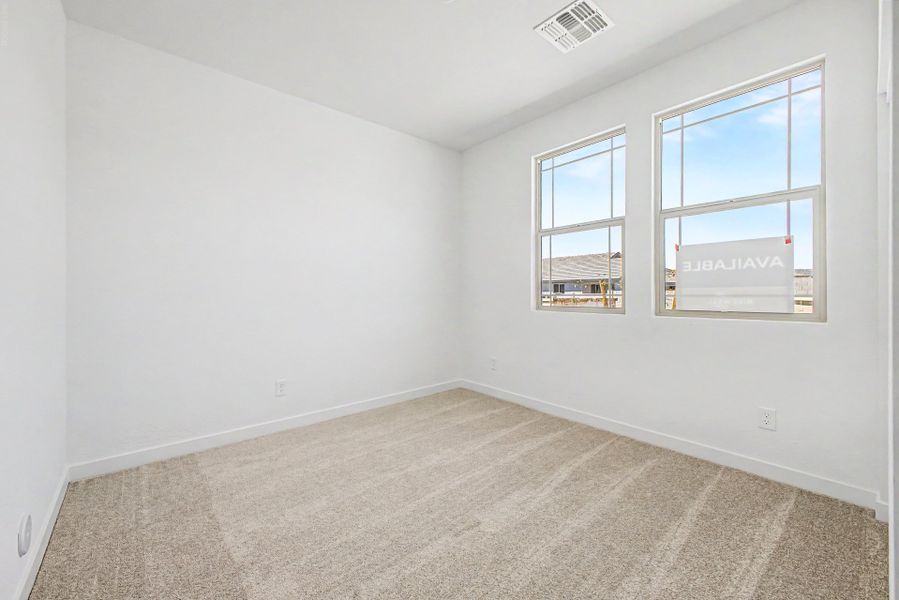 Spacious, unfurnished interior of a new home in The Villages at North Copper Canyon, Surprise (Image 10).