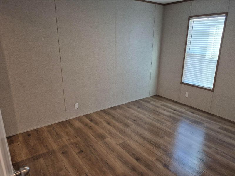 Unfurnished room with wood finished floors