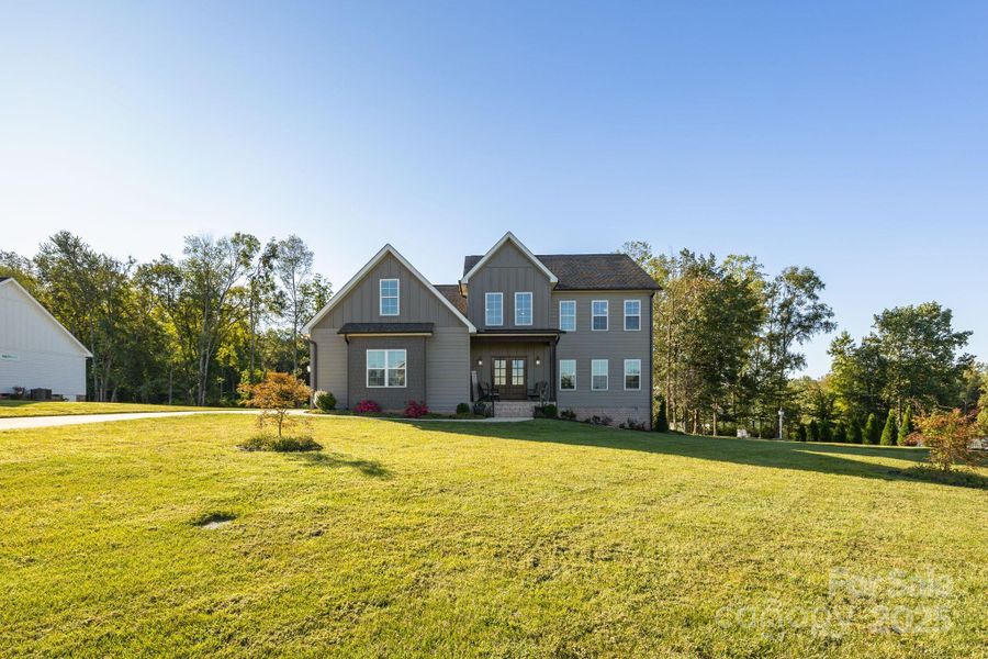 Front exterior of a new home in , Mocksville, NC, highlighting curb appeal (Image 20).