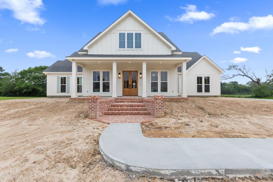 Representative exterior photo of a completed home built from the The Champagne by Manuel Builders in Chapel Bend, Montgomery, TX (Image 25). Representative exterior photo of a completed home built from the The Champagne by Manuel Builders in Chapel Bend, Montgomery, TX (Image 25).