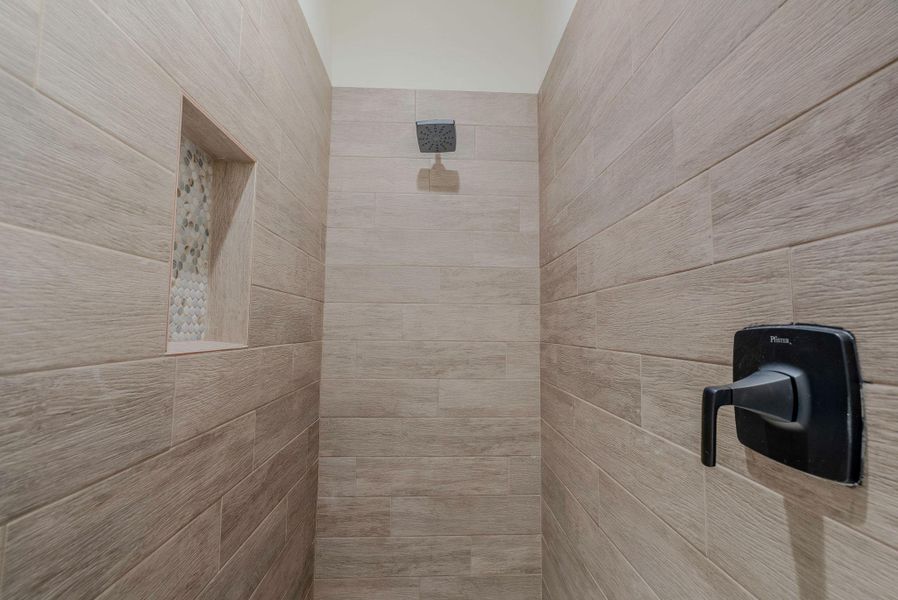 Bathroom view of a tile shower Bathroom view of a tile shower