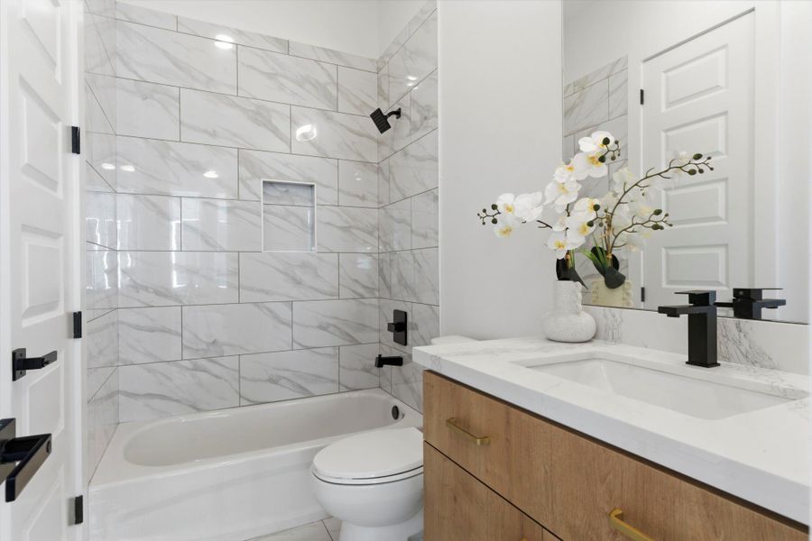 Well-designed Jack-and-Jill bathroom connecting the 2nd floor bedroom and living area—perfect for both convenience and accessibility.