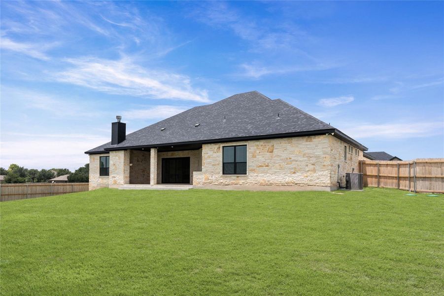 A spacious backyard with vibrant green grass and privacy fencing awaits in this single-story residence. A spacious backyard with vibrant green grass and privacy fencing awaits in this single-story residence.