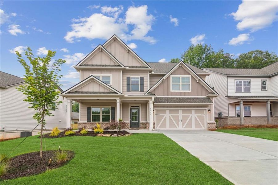 Front exterior of a new home in , Flowery Branch, GA, highlighting curb appeal (Image 2).