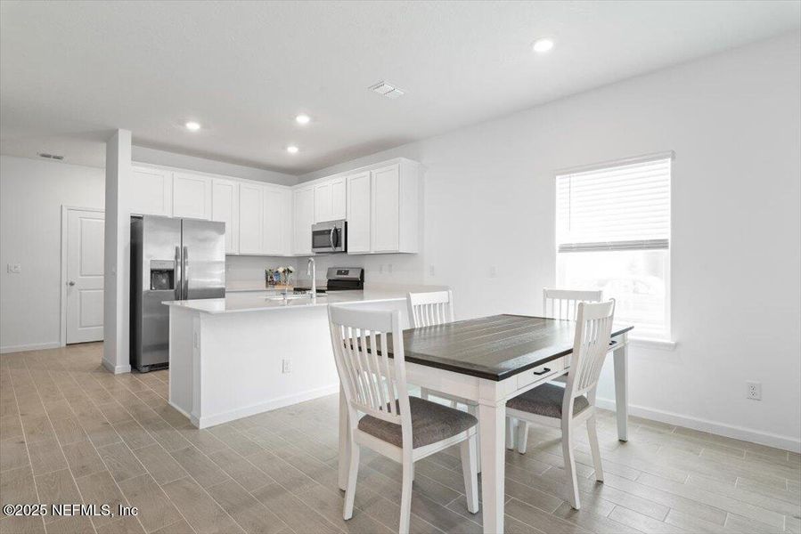 Furnished interior view inside a new home in Hardwick Farms: Hardwick Farms - Townhome Collection, Jacksonville (Image 11).