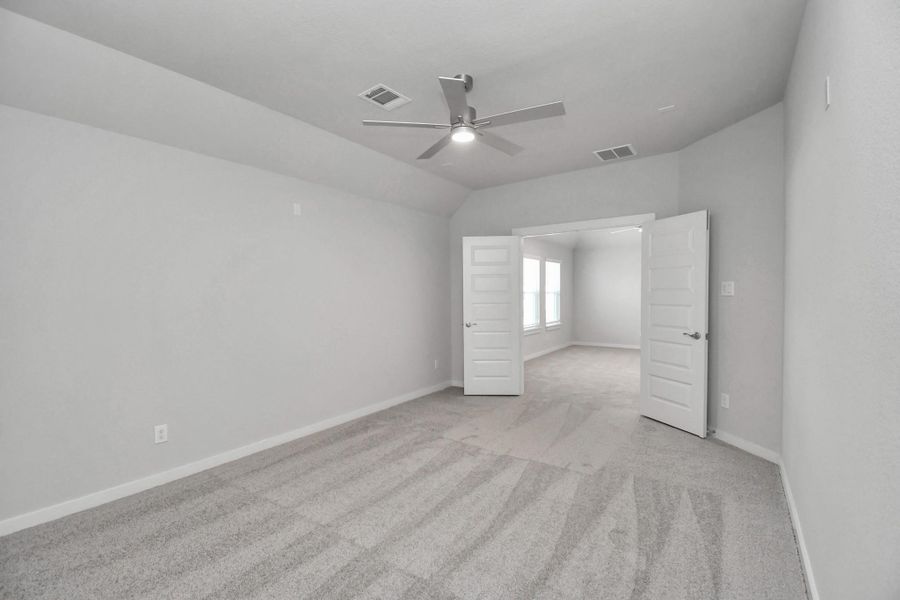 Take a look at this spacious media room, perfect for family movie nights!
