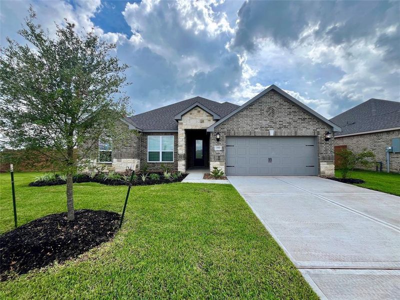 Nestled on a desirable corner lot, this stunning home showcases a gorgeous stone and brick façade, enhanced by beautifully manicured landscaping that adds to its undeniable curb appeal