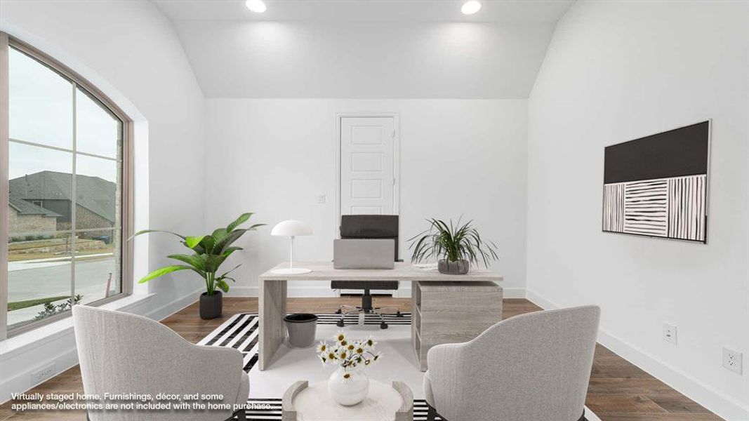 Office area featuring dark hardwood / wood-style flooring and vaulted ceiling