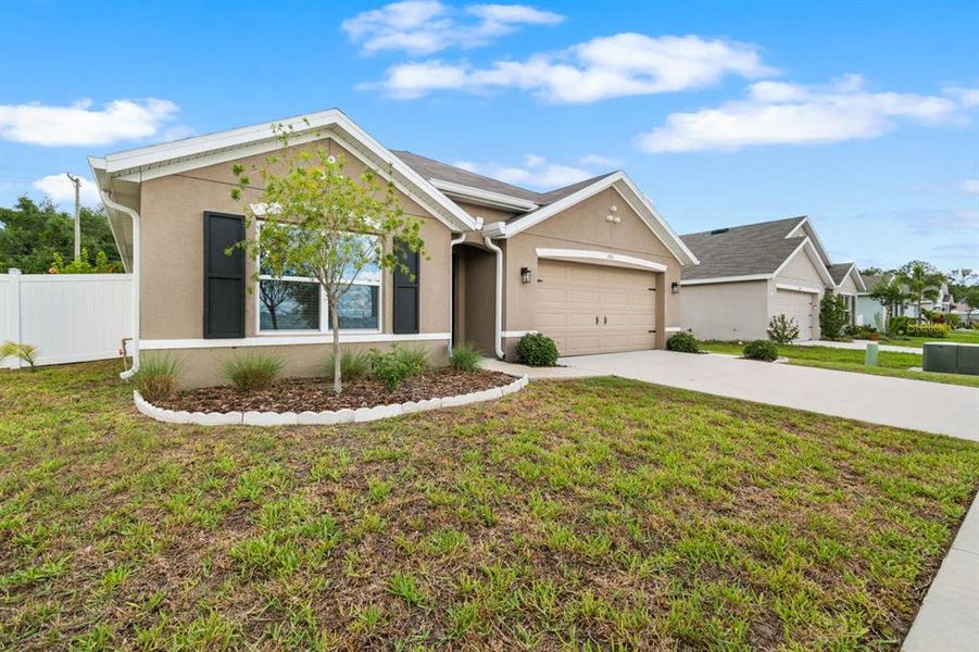 Front exterior of a new home in Brookside, Ruskin, FL, highlighting curb appeal (Image 29).