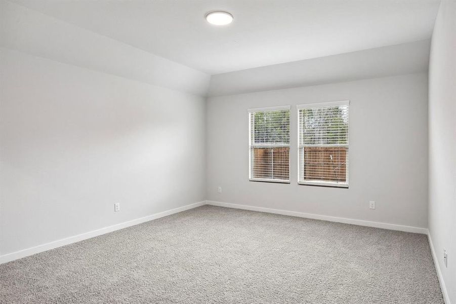 Primary Suite in the Heisman home plan by Trophy Signature Homes – REPRESENTATIVE PHOTO