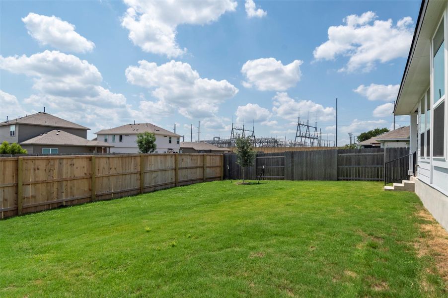 Front exterior of a new home in Orchard Ridge, Liberty Hill, TX, highlighting curb appeal (Image 2). Front exterior of a new home in Orchard Ridge, Liberty Hill, TX, highlighting curb appeal (Image 2).