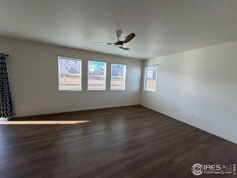 Living room with LVT flooring and remove controlled fan. Living room with LVT flooring and remove controlled fan.
