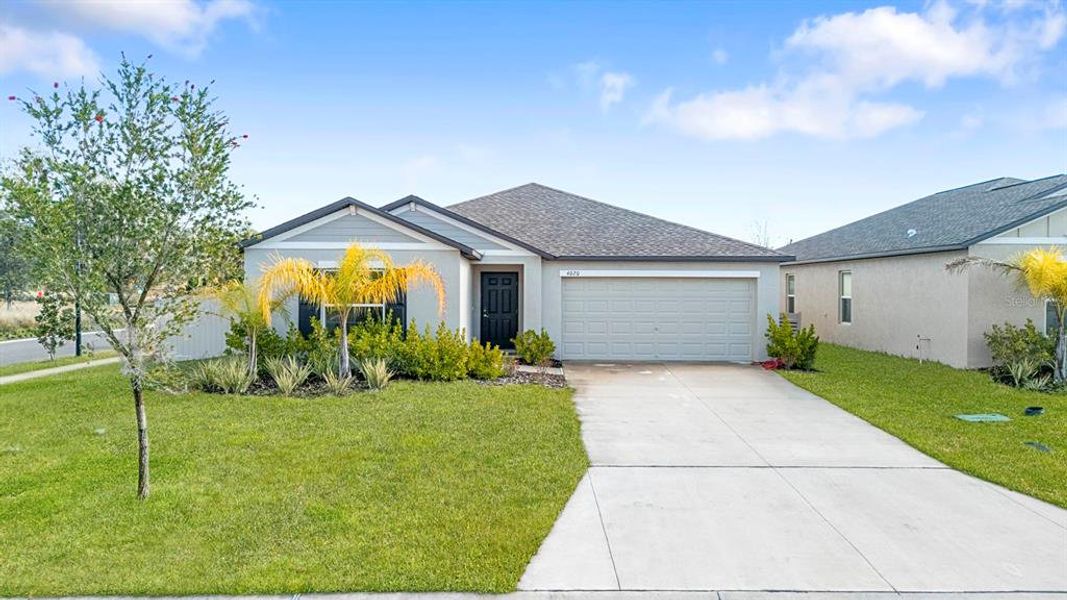 Front exterior of a new home in North Park Isle: The Estates II, Plant City, FL, highlighting curb appeal (Image 2). Front exterior of a new home in North Park Isle: The Estates II, Plant City, FL, highlighting curb appeal (Image 2).