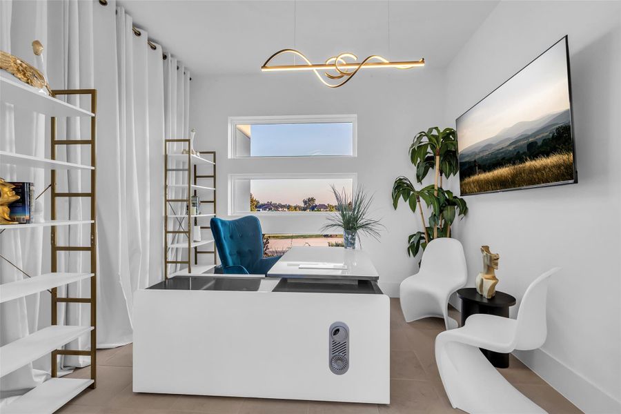 Executive Office:Behind glass French doors, a refined office awaits where natural light, tailored finishes, and thoughtful design create a setting of quiet authority. This is a space for focus and leadership, where sophistication elevates every moment of work and creativity.