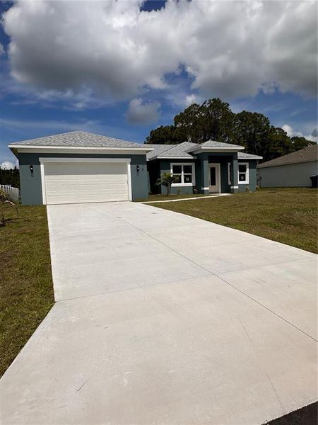 Front exterior of a new home in , Palm Bay, FL, highlighting curb appeal (Image 2). Front exterior of a new home in , Palm Bay, FL, highlighting curb appeal (Image 2).