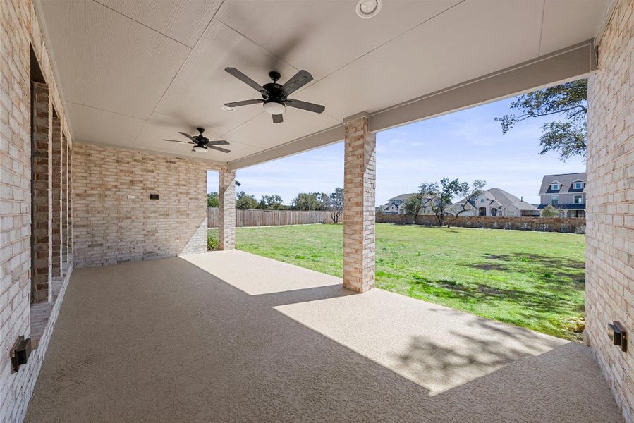 View of patio / terrace featuring a ceiling fan and fence