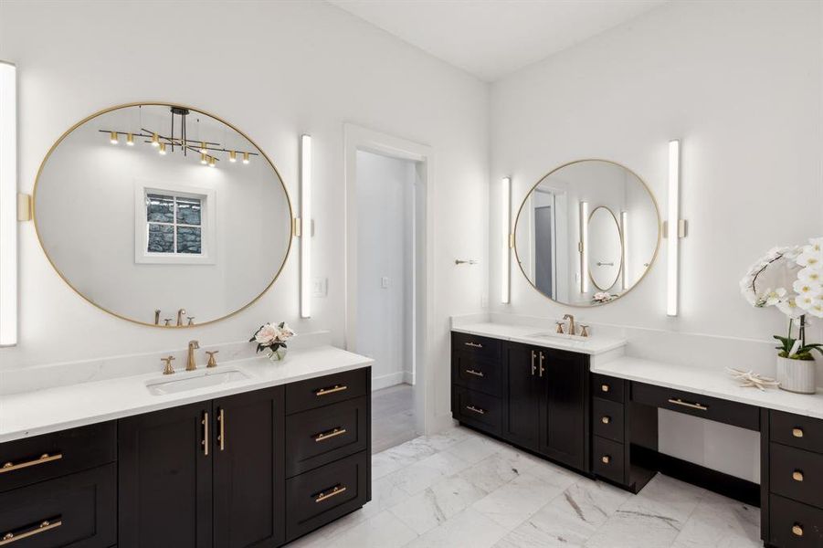 Bathroom featuring dual bowl vanity and tile flooring