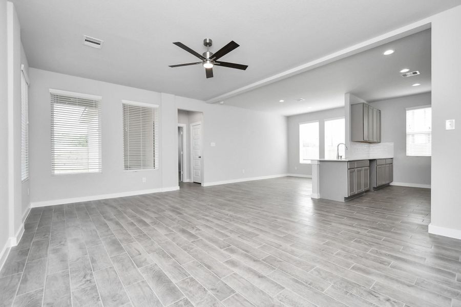 Another view of the heart of the home. Sample photo of completed home with similar floor plan. Actual colors and selections may vary.