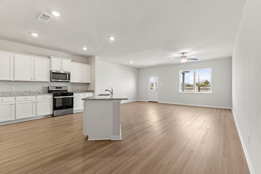 Furnished interior view inside a new home in Canterra Creek, Iowa Colony (Image 3).