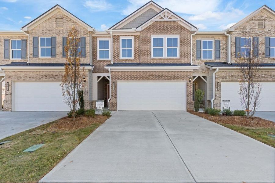 Front exterior of a new home in , Dacula, GA, highlighting curb appeal (Image 1).