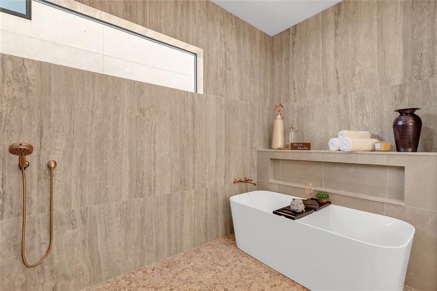 Bathroom with tile walls and a freestanding bath Bathroom with tile walls and a freestanding bath