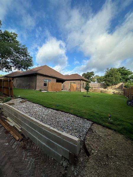 View of fenced backyard