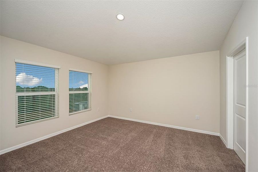 Spacious, unfurnished interior of a new home in Scenic Terrace, Haines City (Image 24).