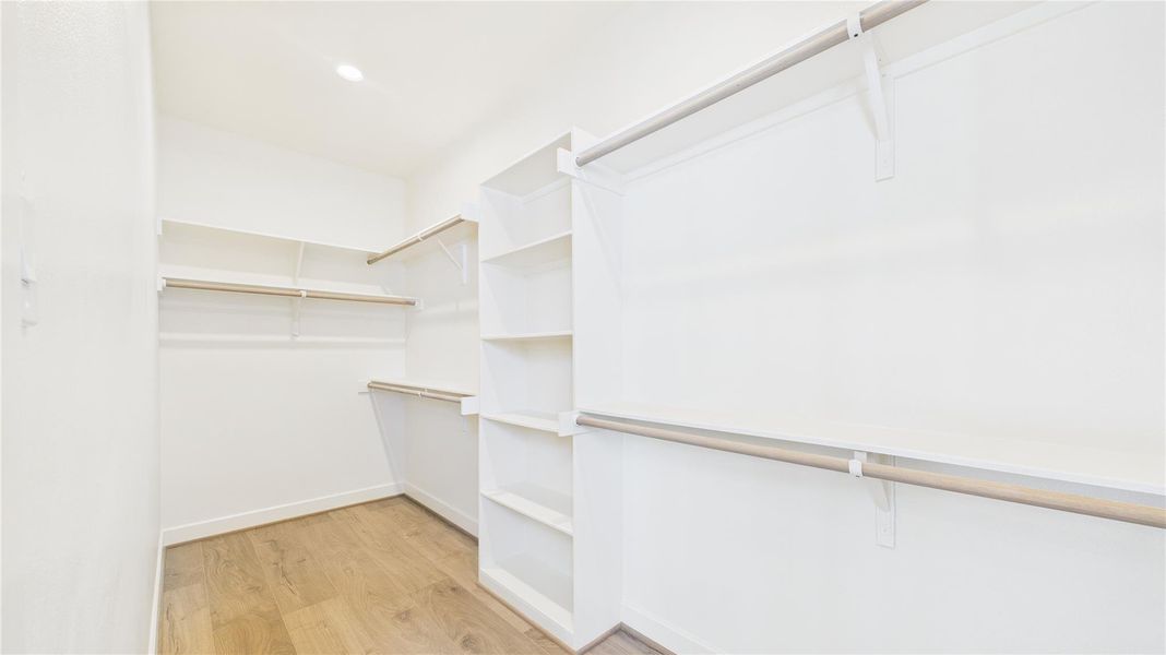 Primary walk-in closet. Primary walk-in closet.