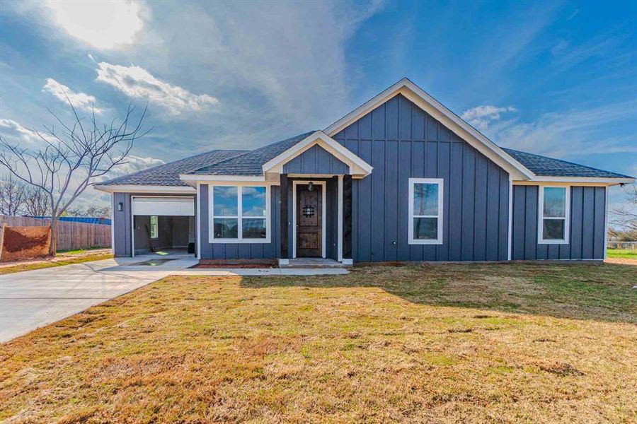 Front exterior of a new home in , Granbury, TX, highlighting curb appeal (Image 22). Front exterior of a new home in , Granbury, TX, highlighting curb appeal (Image 22).