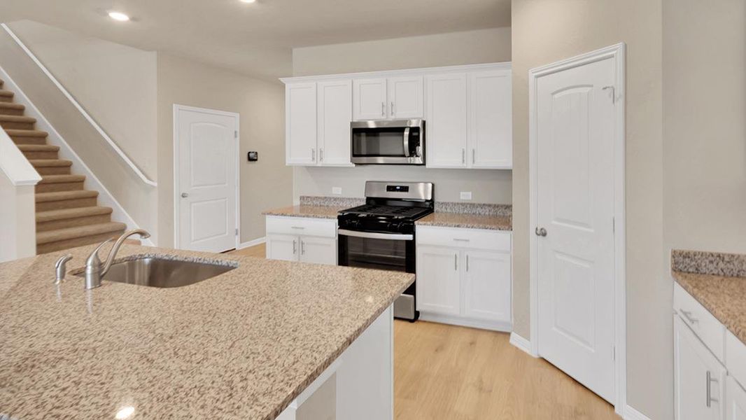Furnished interior view inside a new home in Bar W Ranch, Leander (Image 9).