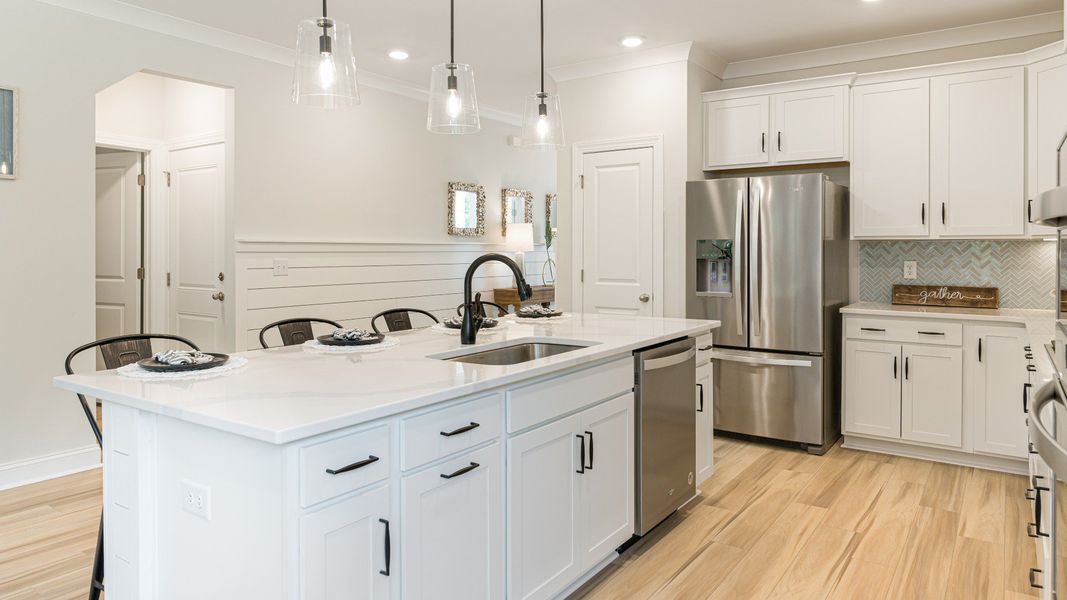 gorgeous island with tons of seating in expansive kitchen with stainless steel appliances gorgeous island with tons of seating in expansive kitchen with stainless steel appliances