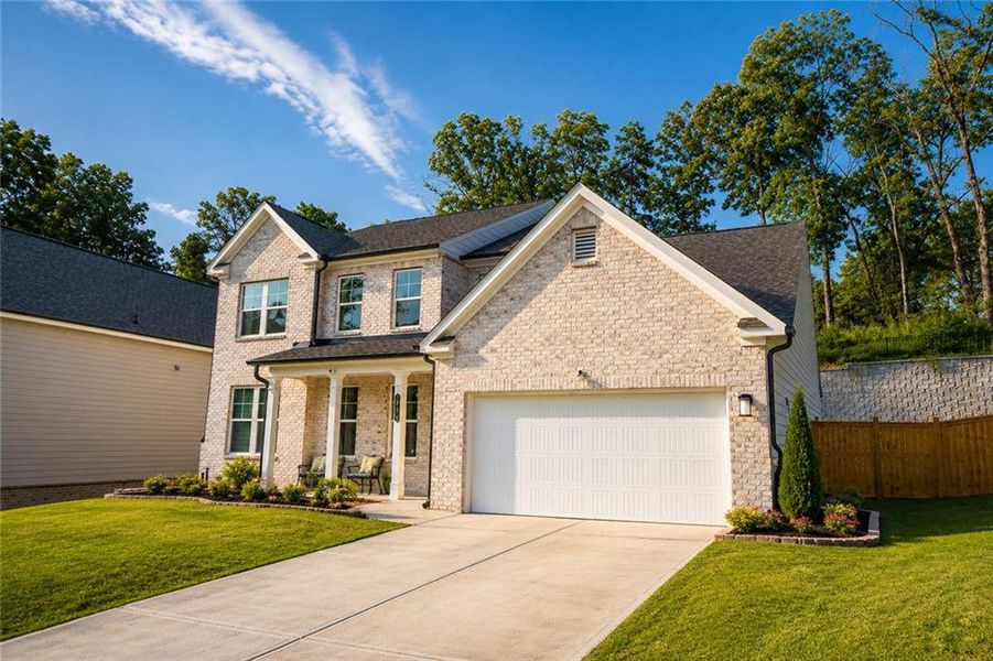 Front exterior of a new home in , Lawrenceville, GA, highlighting curb appeal (Image 27). Front exterior of a new home in , Lawrenceville, GA, highlighting curb appeal (Image 27).