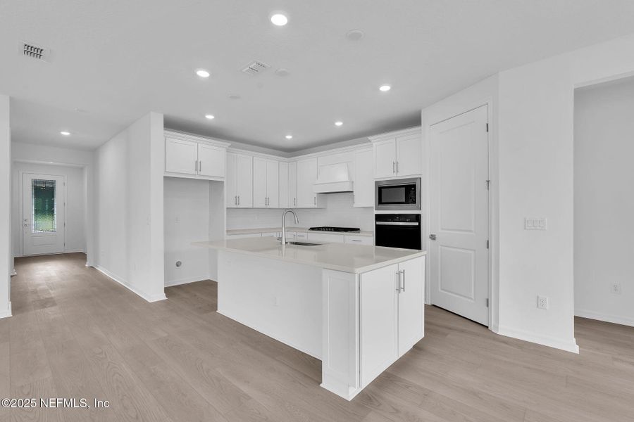 Furnished interior view inside a new home in Summer Bay at Grand Oaks, St. Augustine (Image 4).
