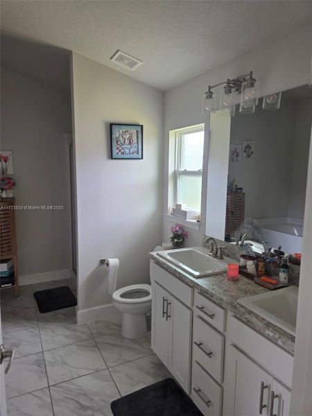 Furnished interior view inside a new home in Waterstone 62, Fort Pierce (Image 17).