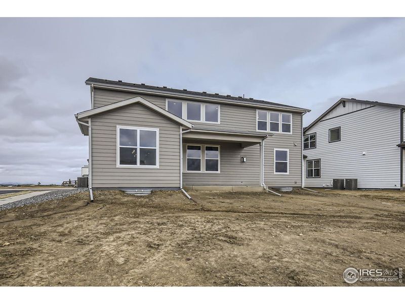 Exterior details and patio area of a home in RainDance, Windsor (Image 3).