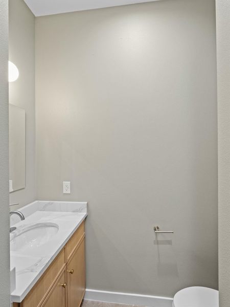 Modern vanity with a white countertop and integrated sink