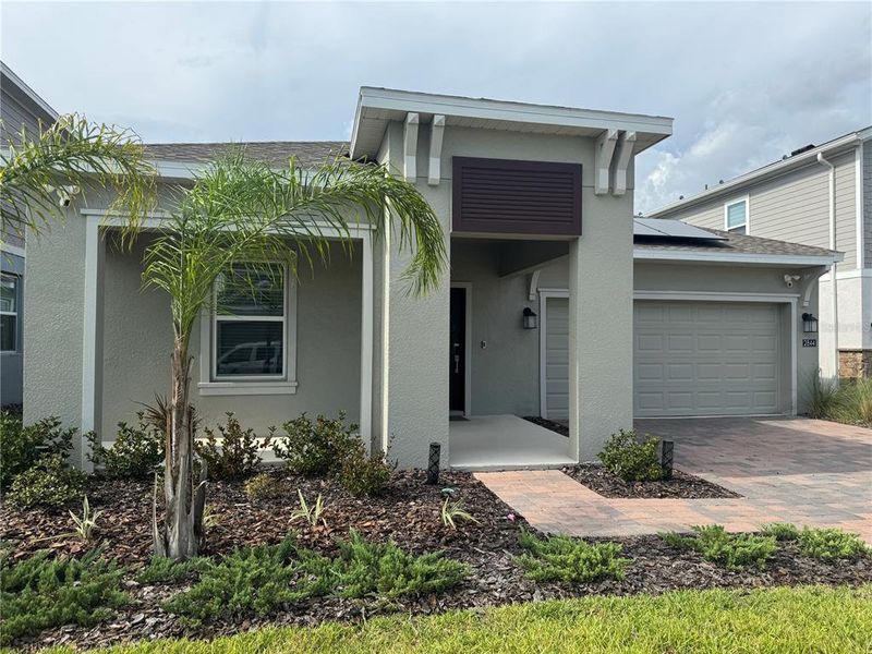 Front exterior of a new home in , Clermont, FL, highlighting curb appeal (Image 1). Front exterior of a new home in , Clermont, FL, highlighting curb appeal (Image 1).