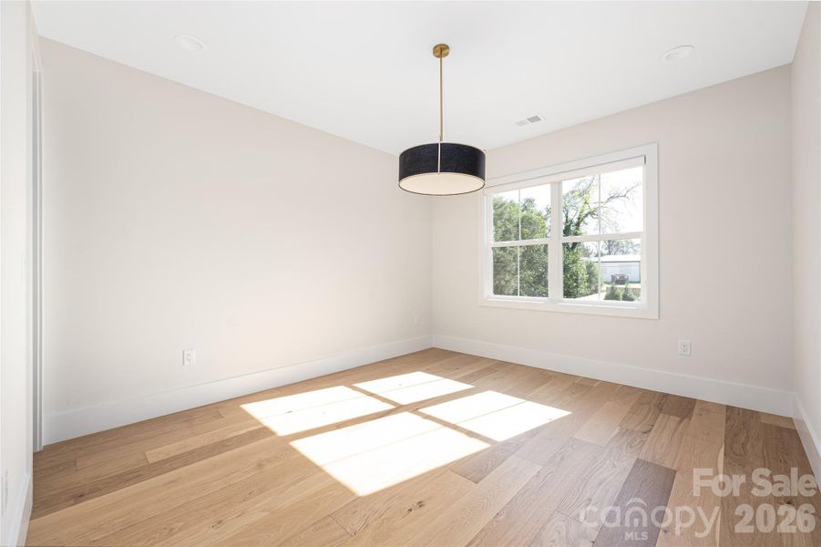 Upper-level guest bedroom 1.