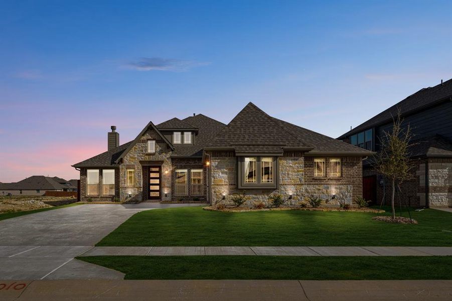 Front exterior of a new home in Timberbrook, Justin, TX, highlighting curb appeal (Image 2).