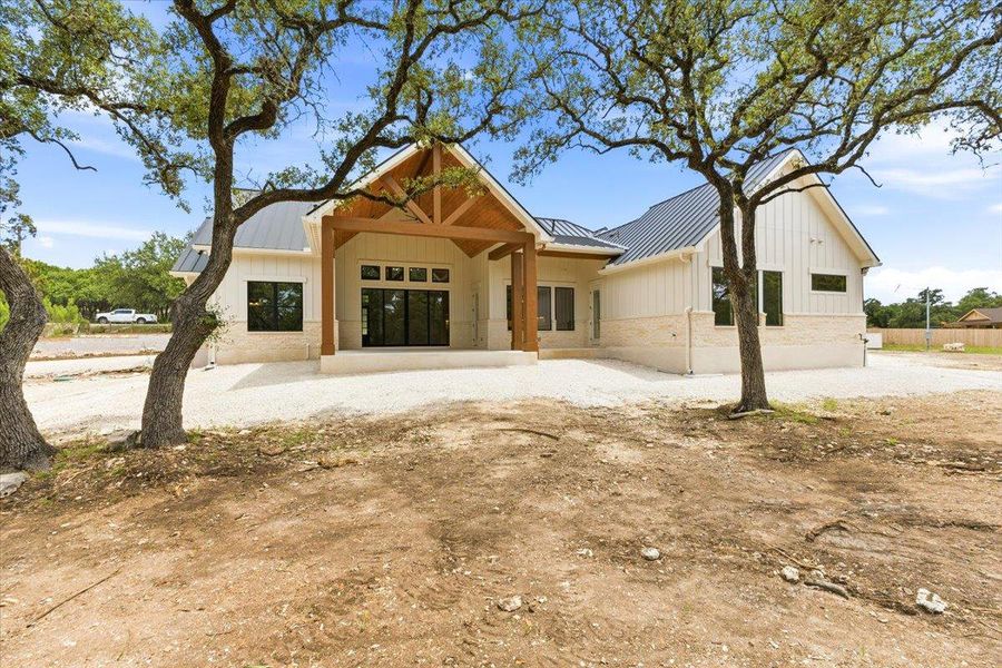 A newly constructed residence showcasing a modern farmhouse aesthetic with ample natural light.