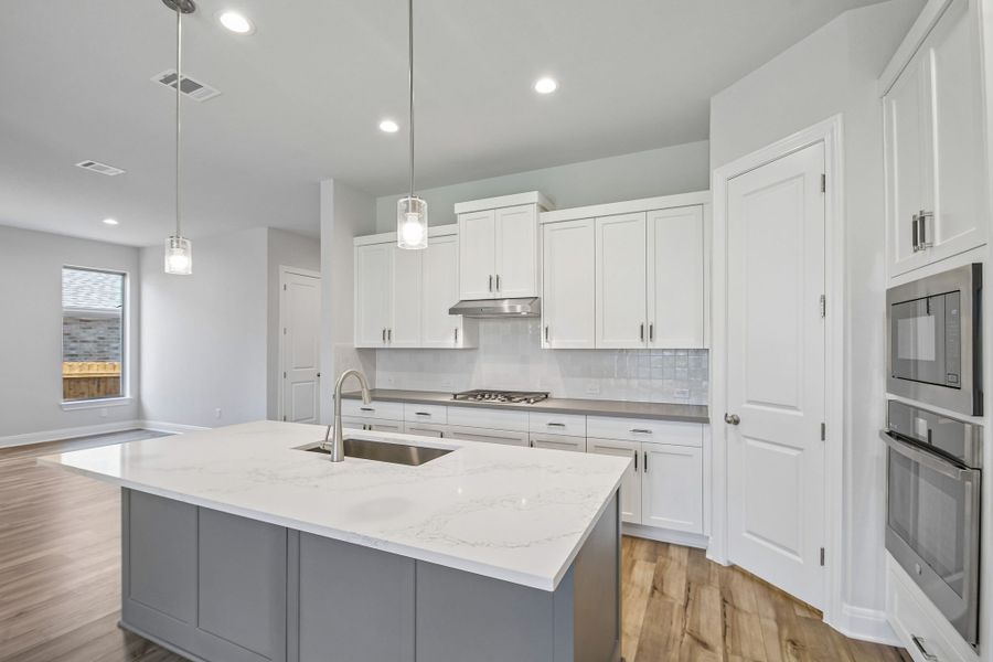 Furnished interior view inside a new home in 6 Creeks, Kyle (Image 7).