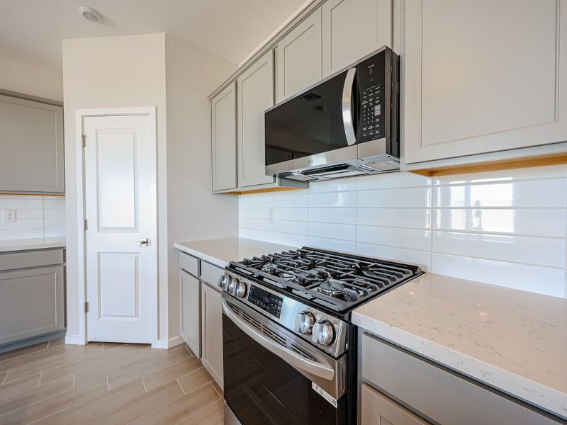 A kitchen with white cabinets. A kitchen with white cabinets.