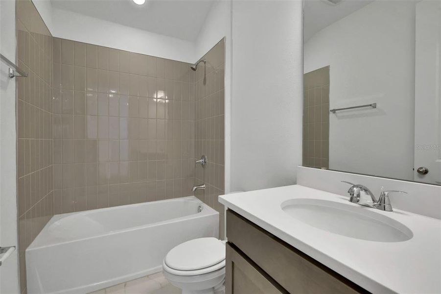 Furnished interior view inside a new home in Serenade at Ovation, Winter Garden (Image 12).