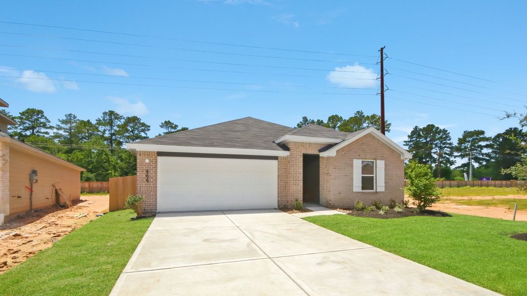 Front exterior of a new home in Maple Woods, Hockley, TX, highlighting curb appeal (Image 2). Front exterior of a new home in Maple Woods, Hockley, TX, highlighting curb appeal (Image 2).