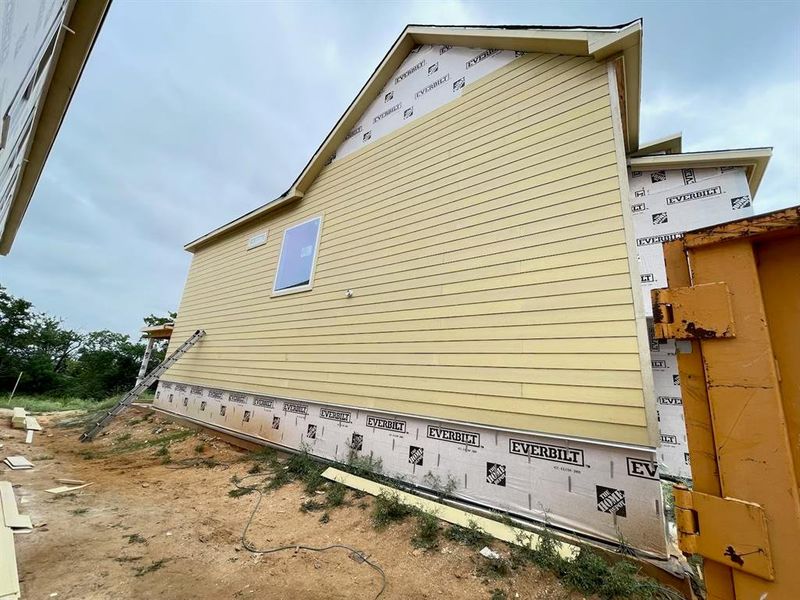 Front exterior of a new home in , Dallas, TX, highlighting curb appeal (Image 10).