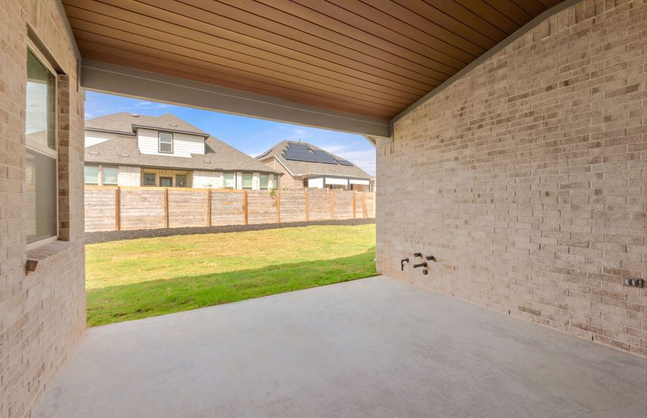 Exterior details and patio area of a home in Bluffview Reserve, Leander (Image 30).