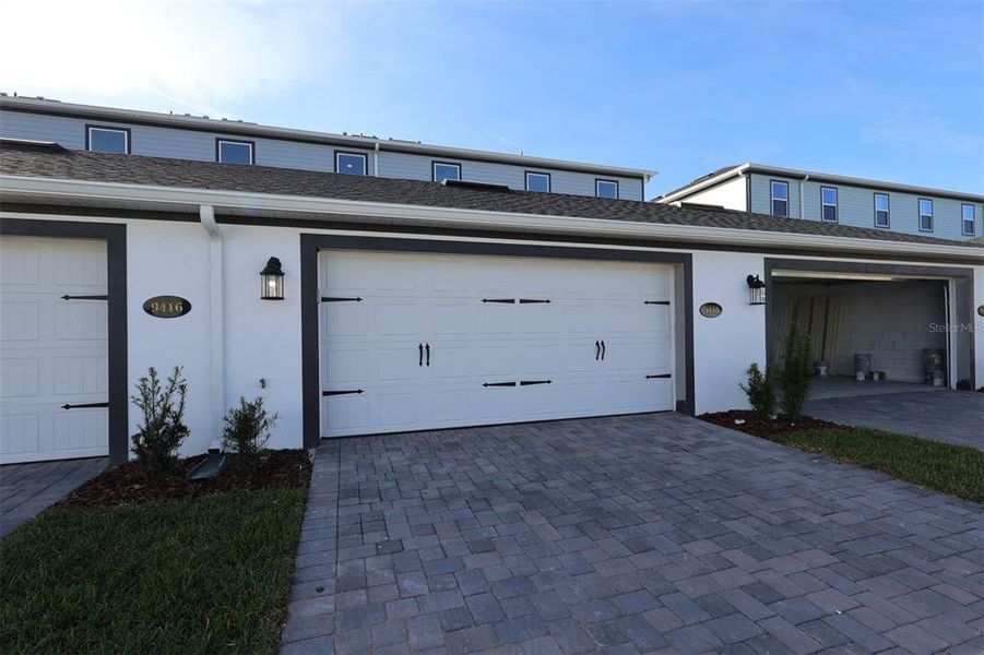 Exterior details and patio area of a home in Tribute at Ovation, Winter Garden (Image 4). Exterior details and patio area of a home in Tribute at Ovation, Winter Garden (Image 4).