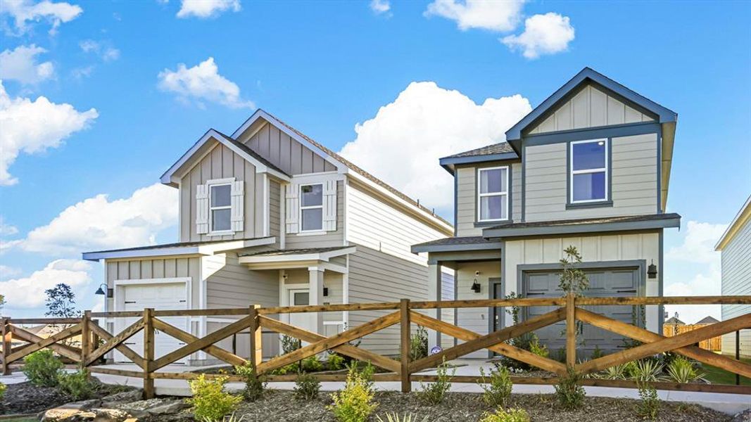 View of front of house featuring board and batten siding, a shingled roof, a garage, and a gate